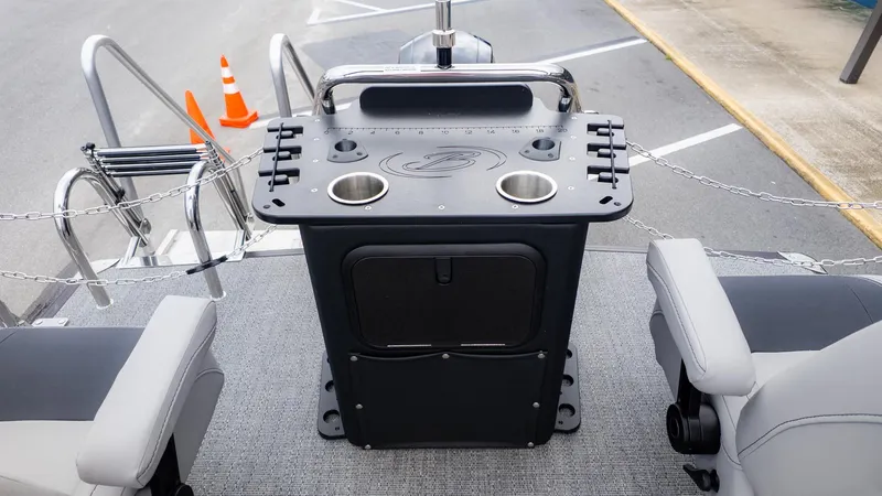 Slide: The Image of The image shows the cockpit of a 2026 Barletta Aria A22CC with cup holders. - 5