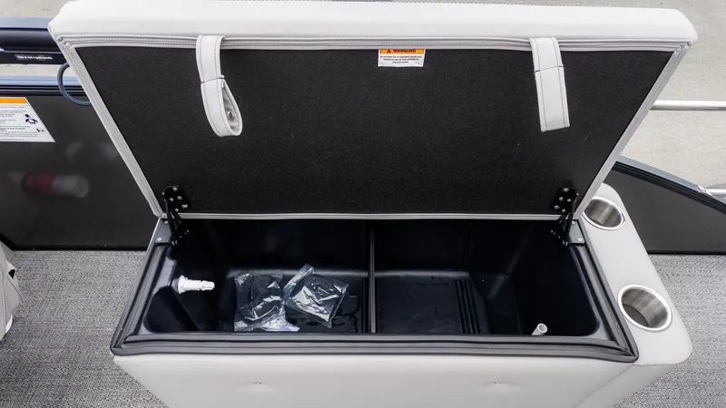 Slide: The Image of The open storage box on the Barletta Aria A22CC reveals a spacious compartment with cup holders. - 8