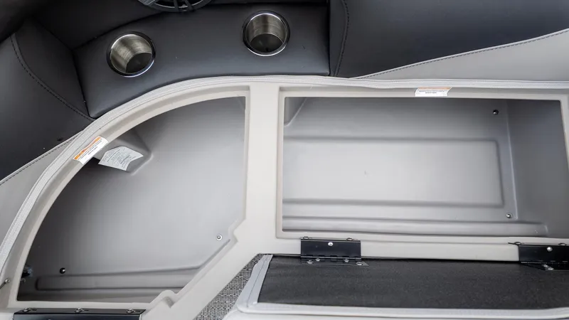 Slide: The Image of Interior view of a Barletta Aria A22CC boat with storage compartment and cup holders. - 19