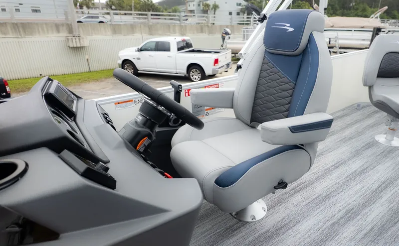 Slide: The Image of Helm of a Bennington 21 S Fish and Cruise with padded seat and steering wheel. - 19