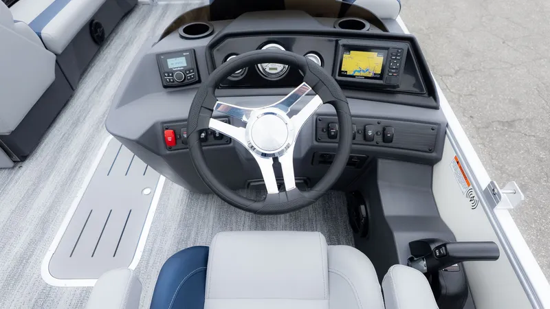 Slide: The Image of The image shows the cockpit of a 2026 Bennington 21 S Fish and Cruise boat with a modern helm. - 21
