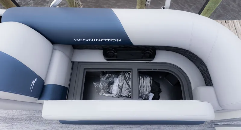 Slide: The Image of The image shows a Bennington boat seat with storage underneath. - 15