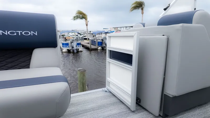 Slide: The Image of A modern pontoon boat seating area overlooking a marina. - 12