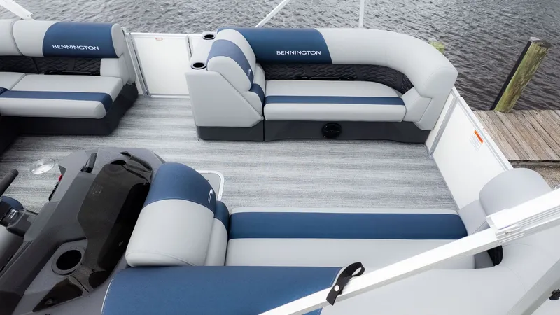 Slide: The Image of Interior view of a Bennington 21 S Fish and Cruise pontoon boat with blue and gray seating. - 12