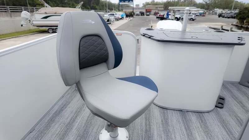 Slide: The Image of A gray and blue boat seat on a Bennington 21 S Fish and Cruise. - 5