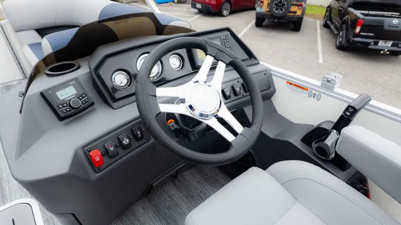 Slide: The Image of Steering wheel and dashboard of a modern boat with gray seating. - 19
