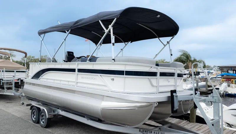 Slide: The Image of Bennington 21 S Fish and Cruise pontoon boat on a trailer. - 22