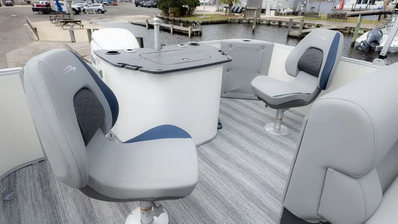 Slide: The Image of The image shows the interior of a Bennington 21 S Fish and Cruise boat with gray and blue seats. - 3