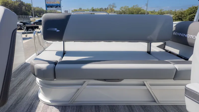 Slide: The Image of The image shows the rear of a Bennington 21 S Swingback pontoon boat with gray upholstery. - 4