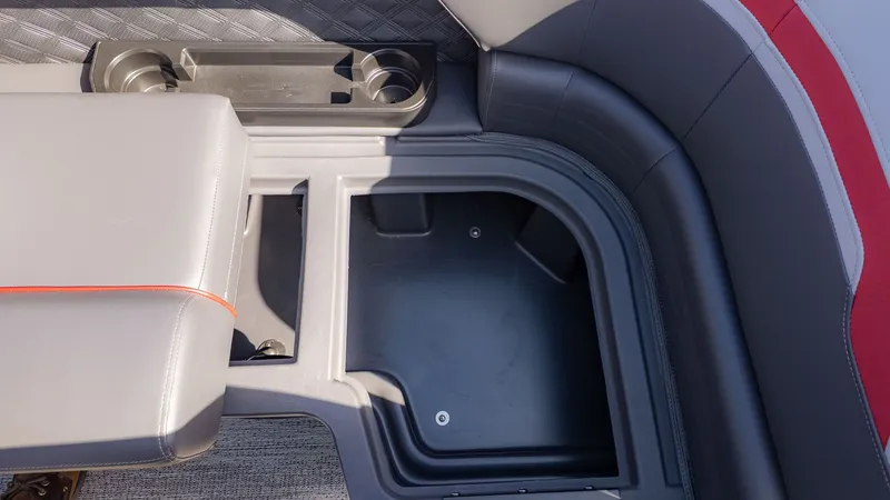 Slide: The Image of Close-up of a seating area with cup holders and storage space. - 13
