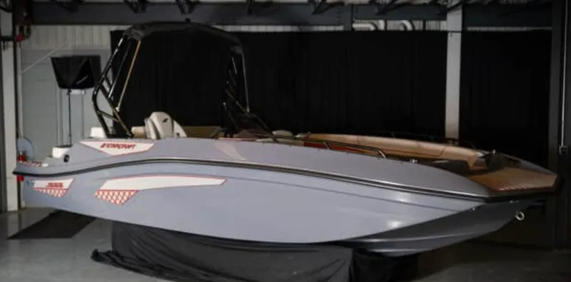 The Image of The image shows a modern Starcraft J9 Jet Super Sport boat from 2027 in a showroom. - 1