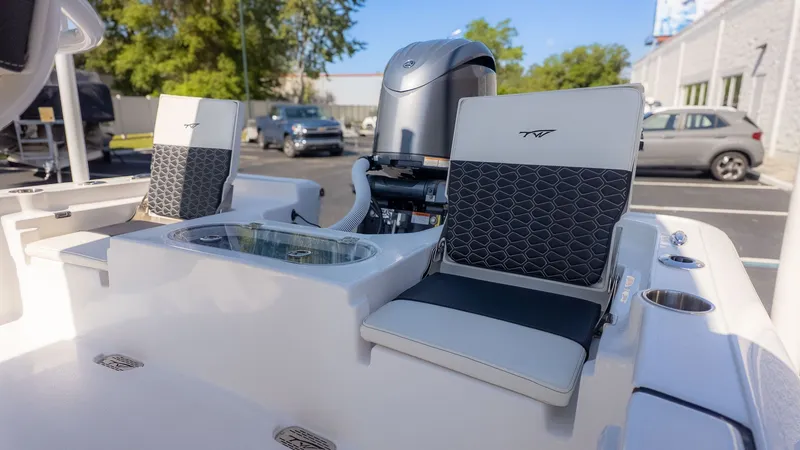 Slide: The Image of The image shows the cockpit of a Tidewater 2110 Bay Max boat with two cushioned seats. - 3