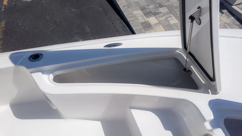 Slide: The Image of The image shows an open storage compartment on a boat, surrounded by white surfaces. - 11