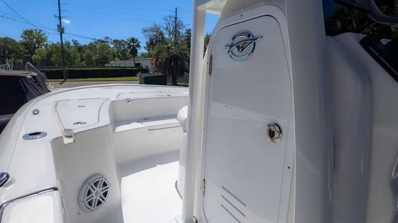 Slide: The Image of The image shows the deck of a 2026 Tidewater 2110 Bay Max boat with white surfaces. - 5