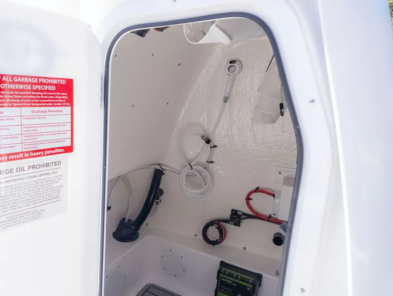 Slide: The Image of Interior view of a boat storage compartment with hoses and cables. - 6