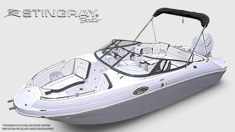 The Image of Stingray 211 DC boat from 2027 with open deck and bimini top. - 1