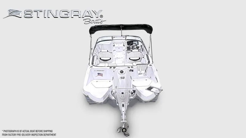 Slide: The Image of Stingray 211 DC boat from 2027 with open deck and black sunshade. - 4