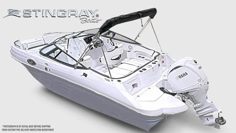 Slide: The Image of Stingray 211 DC from 2027 with Yamaha outboard motor, white hull, and black bimini top. - 10