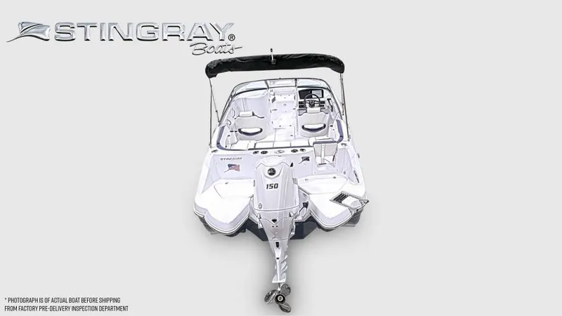 Slide: The Image of Stingray 211 DC boat from 2027 with outboard motor, spacious deck, and seating. - 4