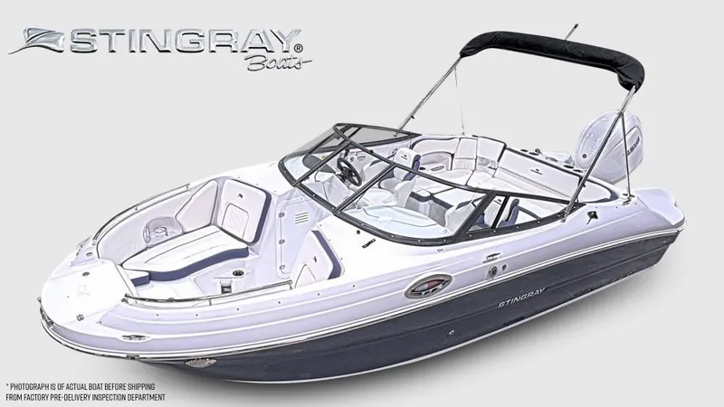 The Image of Stingray 211 DC from 2027 with open deck, seating, and black bimini top. - 1