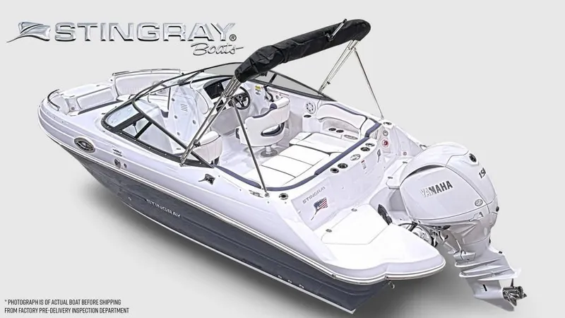 Slide: The Image of A modern Stingray 211 DC with Yamaha outboard motor, white hull, and black bimini top. - 9
