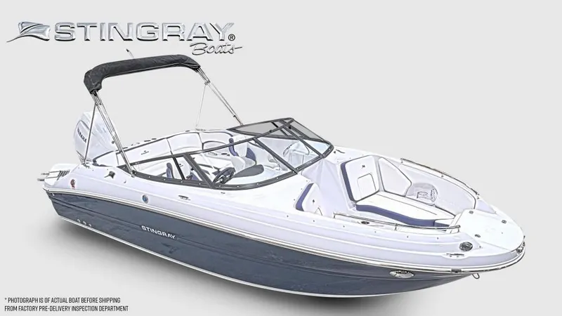 Slide: The Image of The image shows a modern Stingray 211 DC boat with sleek design and a black bimini top. - 6