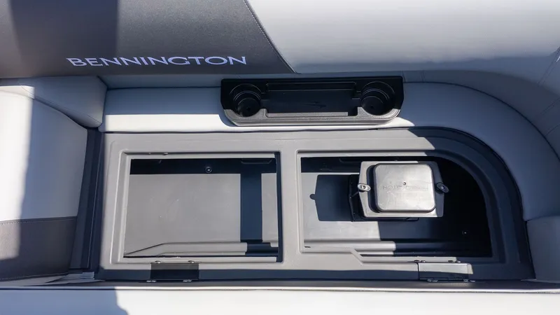 Slide: The Image of The image shows a seating area with built-in storage and cup holders. - 5