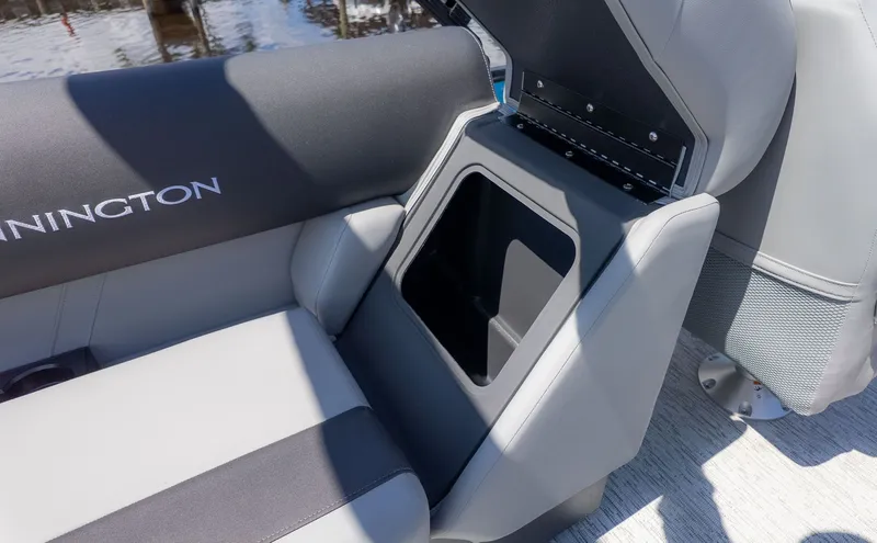 Slide: The Image of Close-up of a seating area on a Bennington boat with gray upholstery. - 8