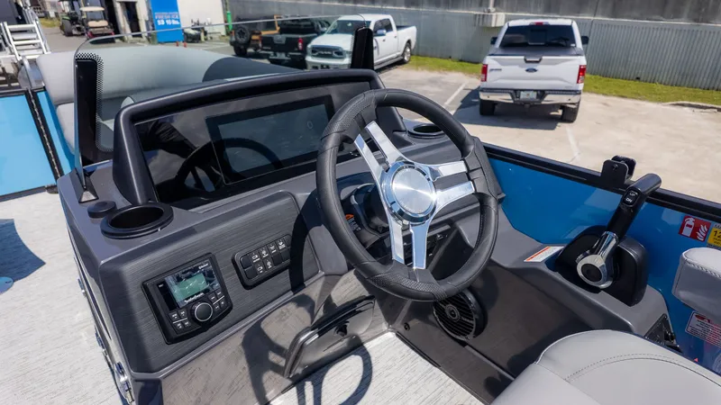 Slide: The Image of The image shows the helm of a 2026 Bennington 22 S STERN RADIUS boat. - 20