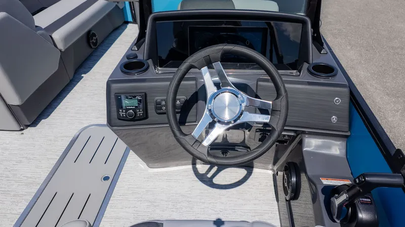 Slide: The Image of The image shows the helm of a Bennington 22 S STERN RADIUS boat with modern controls. - 21
