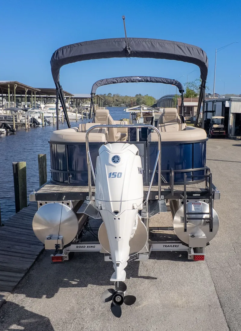 Slide: The Image of Bennington 22 S STERN RADIUS pontoon boat with Yamaha 150 HP engine, parked at the dock. - 4