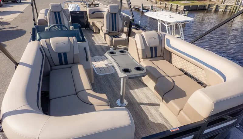 Slide: The Image of The image shows the spacious deck of a Bennington 22 S STERN RADIUS pontoon boat. - 5