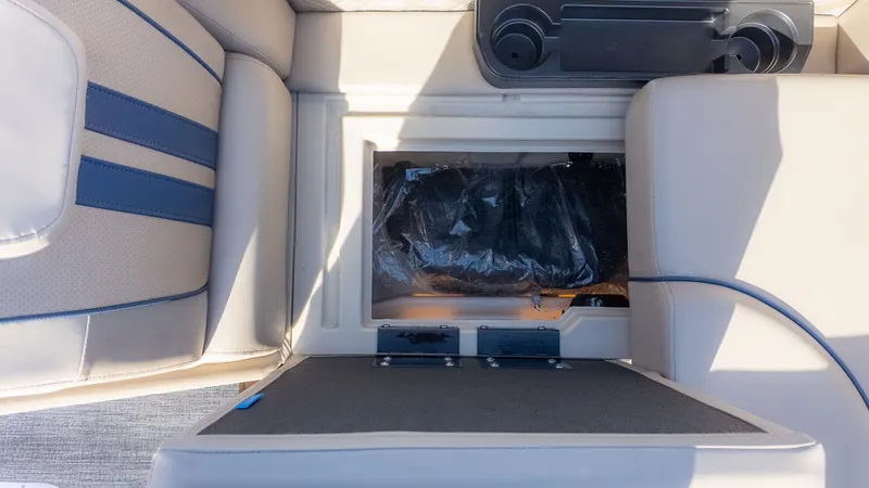 Slide: The Image of Interior view of a boat with cushioned seats and a storage compartment. - 14