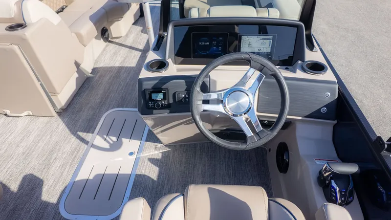 Slide: The Image of The image shows the cockpit of a Bennington 22 S STERN RADIUS boat with a modern steering wheel. - 19