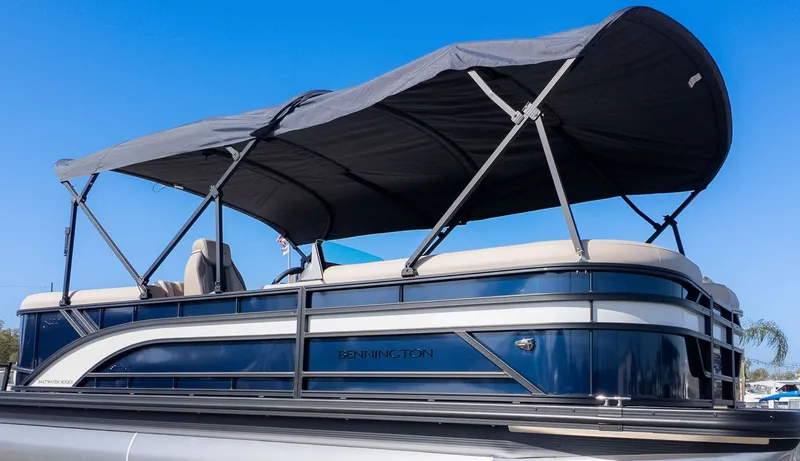 Slide: The Image of Bennington 22 S STERN RADIUS pontoon boat with blue hull and gray sunshade. - 21