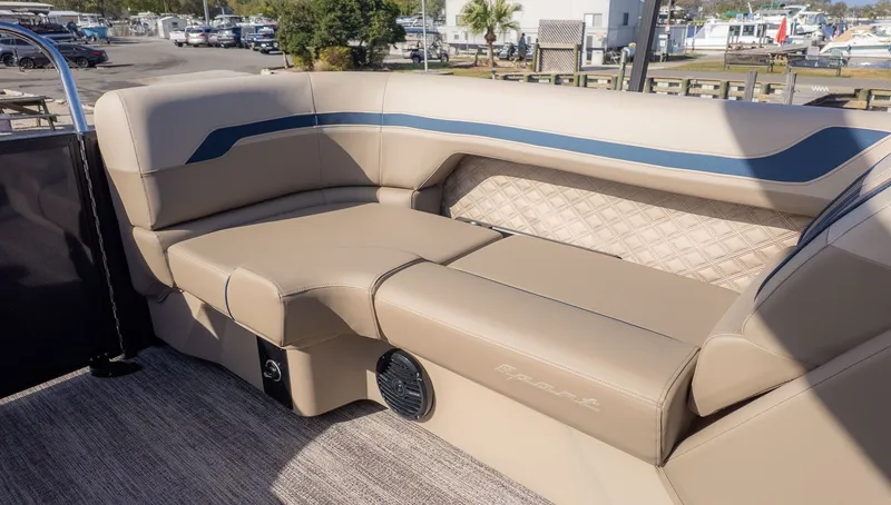 Slide: The Image of The image shows beige seating in the stern area of a Bennington pontoon boat. - 5