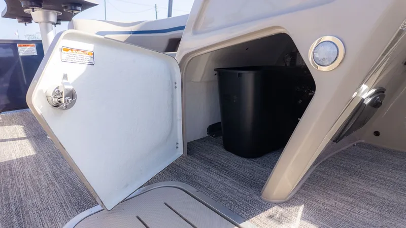 Slide: The Image of An open storage compartment on a 2026 Bennington 22 S STERN RADIUS boat. - 16