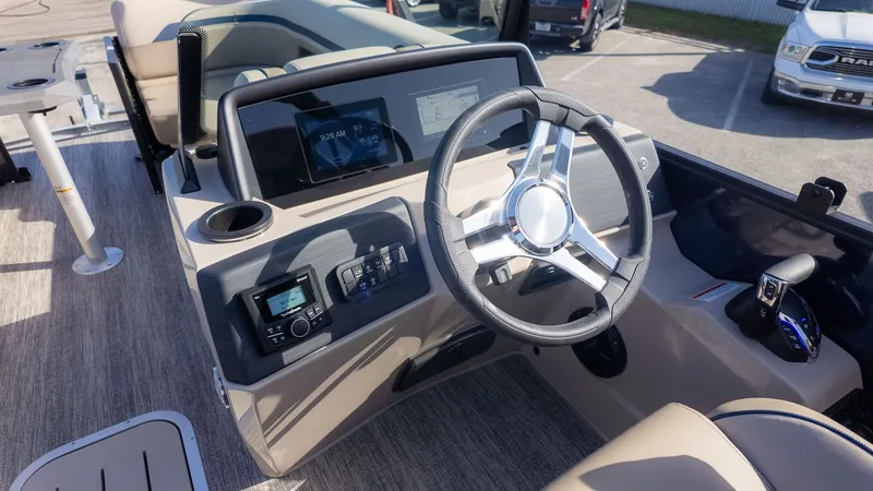Slide: The Image of The image shows the helm of a 2026 Bennington 22 S STERN RADIUS boat. - 18