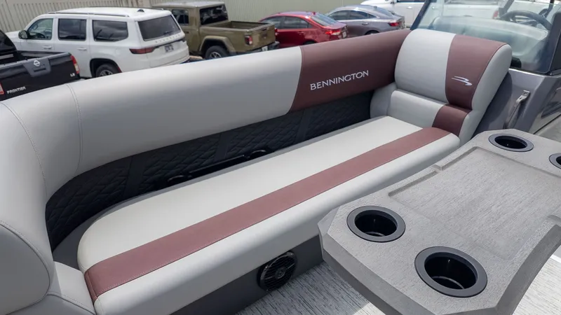 Slide: The Image of Interior view of a Bennington 22 S Swingback with cushioned seating and cup holders. - 12