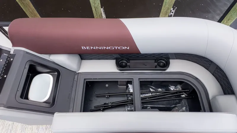 Slide: The Image of Interior view of a Bennington 22 S Swingback with storage compartment and cup holders. - 11