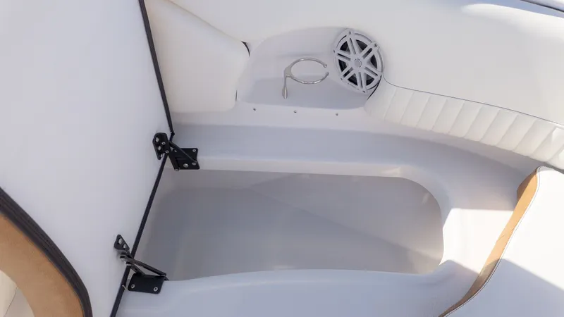 Slide: The Image of Interior of a boat with white upholstery and a speaker. - 20