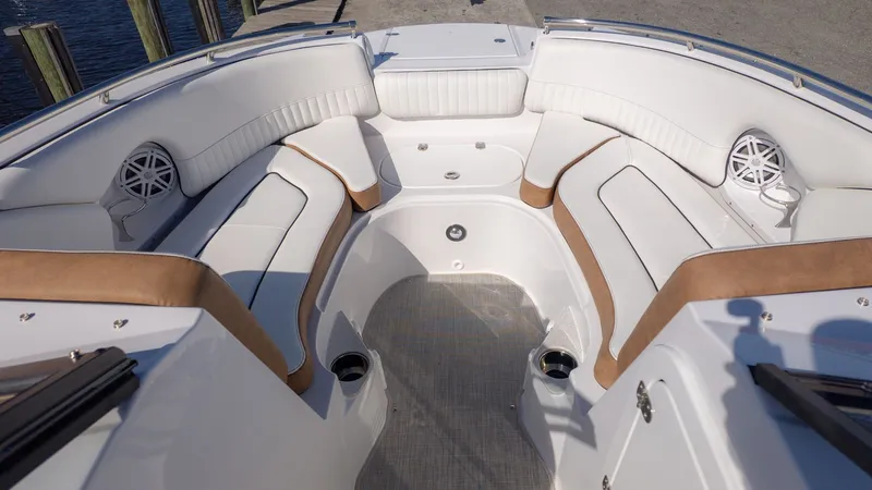 Slide: The Image of The image shows the interior of a boat with white and brown seating. - 18