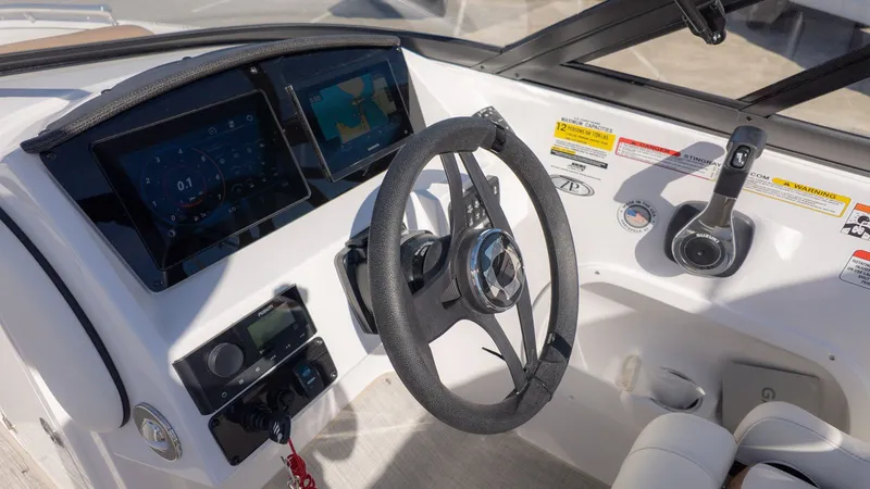 Slide: The Image of Dashboard of a modern boat with steering wheel and digital displays. - 24