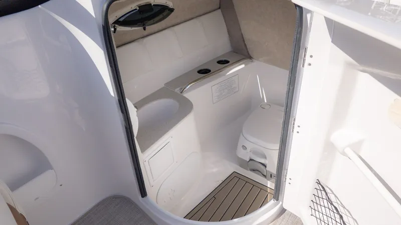 Slide: The Image of Interior of the 2026 Stingray 231 DC featuring a toilet and sink. - 13