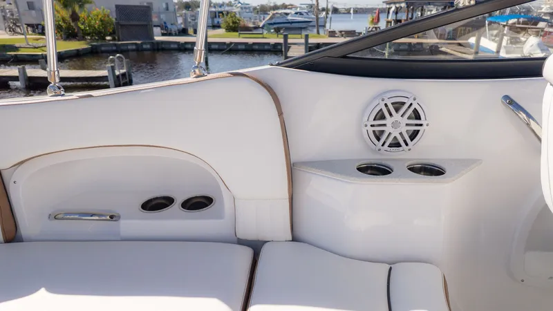 Slide: The Image of Interior of a Stingray 231 DC with white seating and cup holders. - 10
