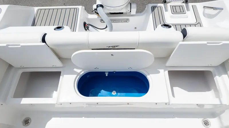 Slide: The Image of The image shows the stern of a Tidewater 210 LXF boat with a blue livewell. - 7