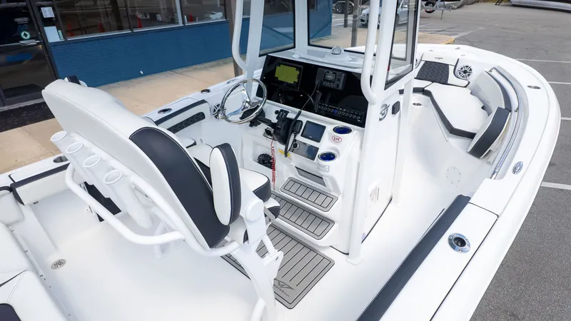 Slide: The Image of The image shows the cockpit of a Tidewater 210 LXF boat with modern controls and seating. - 10