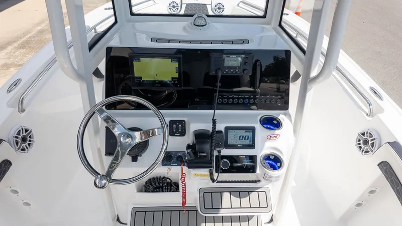 Slide: The Image of The image shows the helm of a Tidewater 210 LXF boat with modern electronics. - 12