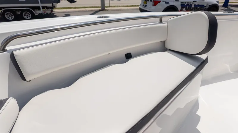 Slide: The Image of The 2027 Tidewater 210 LXF features a sleek, cushioned seating area with stainless steel railing. - 15
