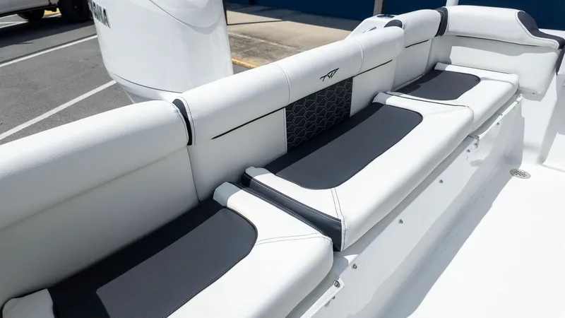 Slide: The Image of Seating area with white and black cushions on a boat. - 4